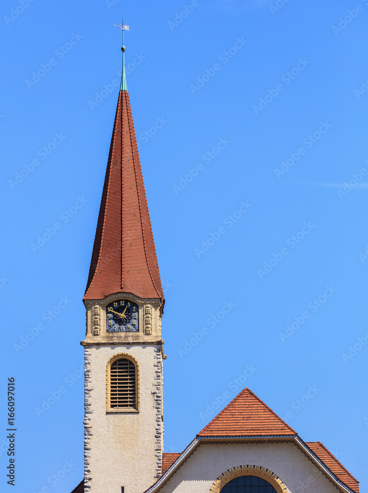 Clock tower of the protestant church in the town of Wallisellen in the Swiss canton of Zurich