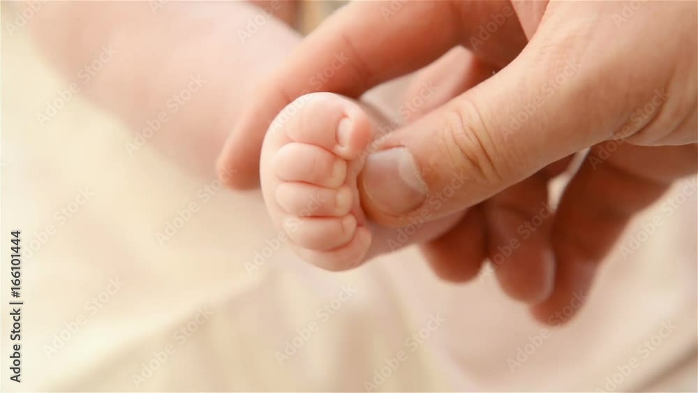 father doing preventive massage her newborn baby father doing preventive massage her newborn baby