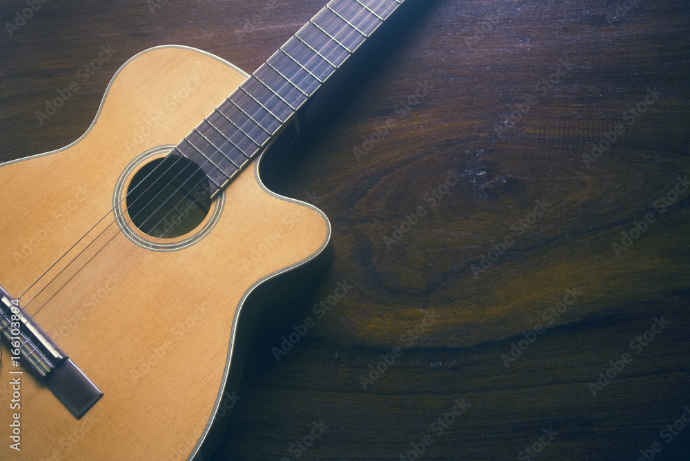 Obraz premium top view of music guitar on wood background