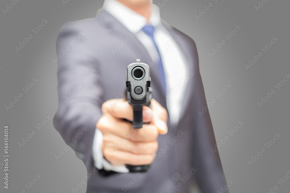 Office man holding semi-automatic gun, Body guard and security concept. Office man holding semi-automatic gun, Body guard and security concept.