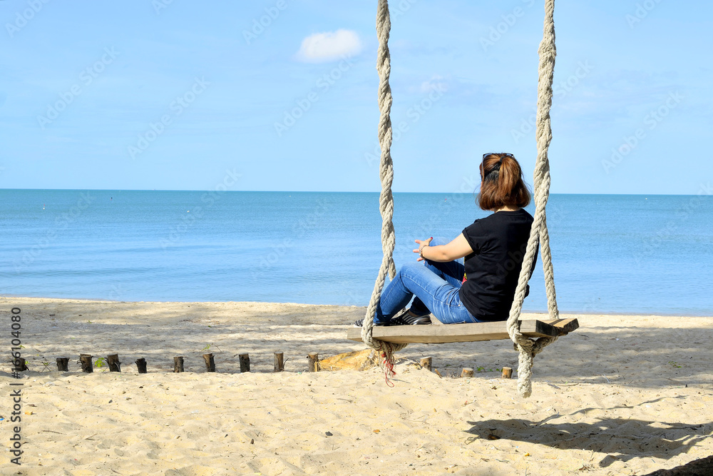 Relaxing on swing at the beach 3