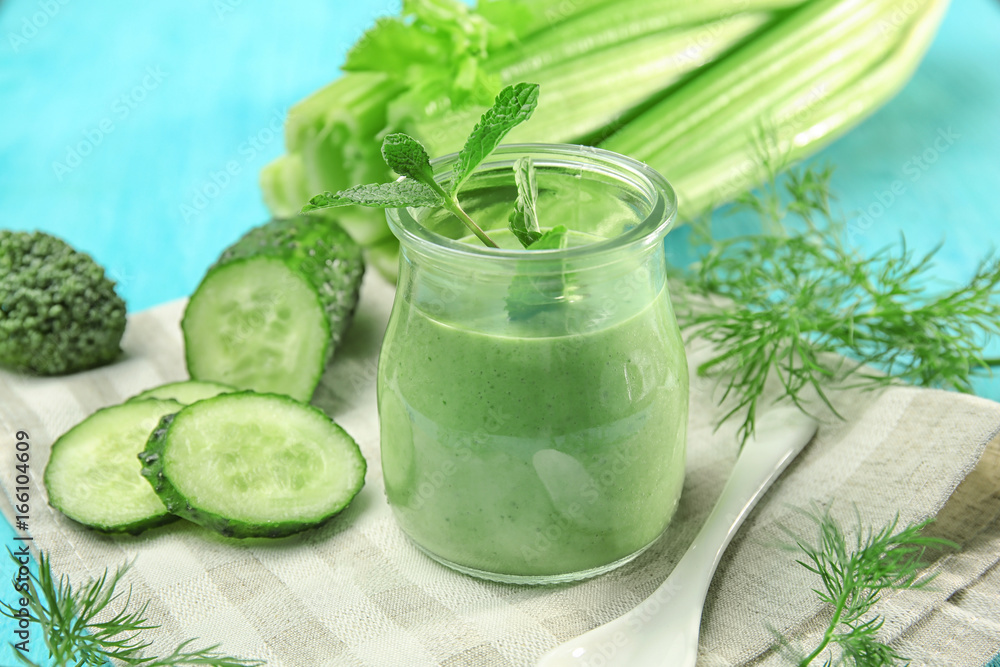 Jar of fresh vegetable juice on color background Jar of fresh vegetable juice on color background