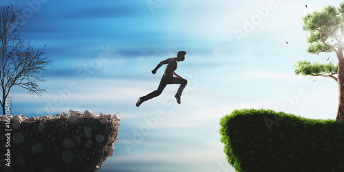 Uomo salta dal passato al futuro su colline photo