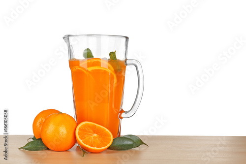 Jug of fresh orange lemonade on white background