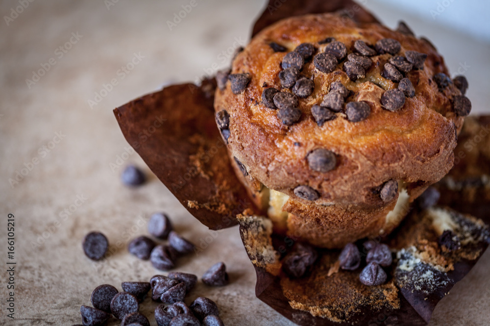 Chocolate chip muffin on a brown background Chocolate chip muffin on a brown background