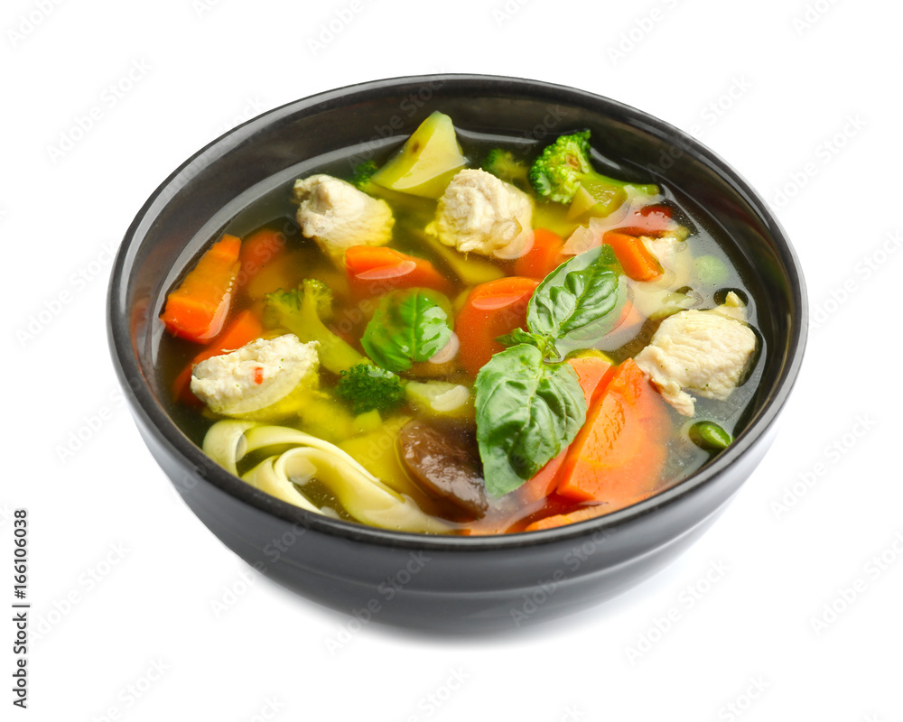 Bowl with delicious turkey soup on white background