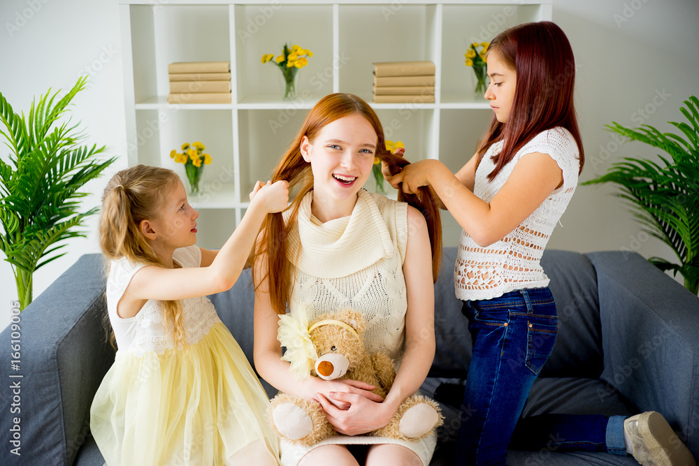 Mother daughter doing hair together