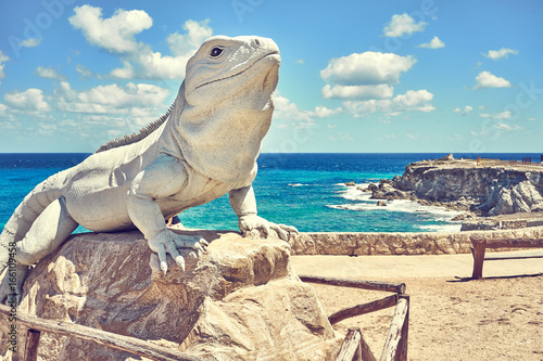 Statue of an Iguana made of stone   Iguana at south end of island  Isla Mujeres  in Mexico 