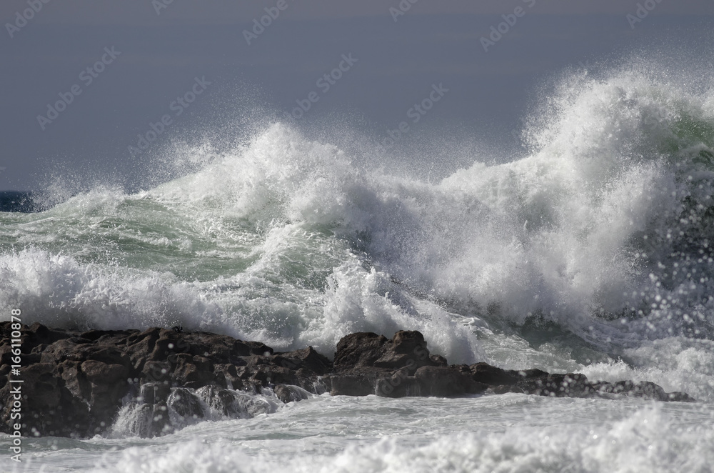 Wave breaking over rocks