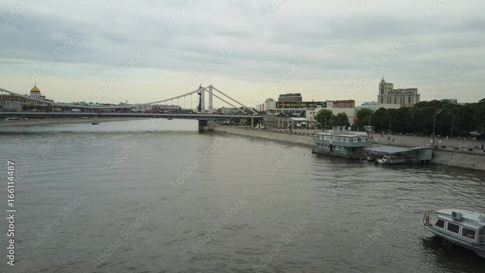 Aerial view of the central region in Moscow, Russia. Bridge over Moscow river, Gorky park, heavy traffic and boats crossing the river 4k Aerial view of the central region in Moscow, Russia. Bridge over Moscow river, Gorky park, heavy traffic and boats crossing the river 4k