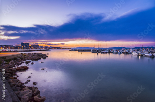 Sunset in quiet mediterranean port of l'Escala, Costa Brava.