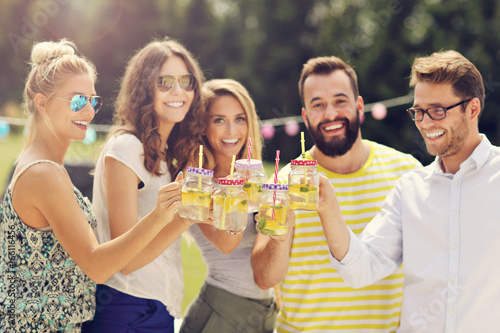 Photography Group of young people cheering and having fun outdoors with drinks