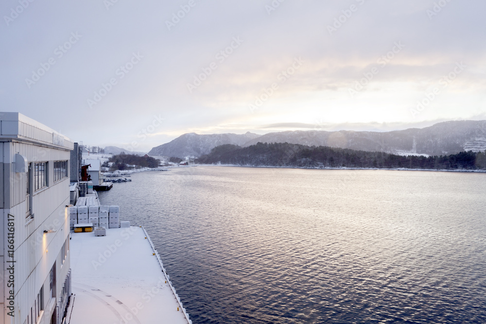Sunrise at a fish processing plant in Ålesund, Norway Stock Photo
