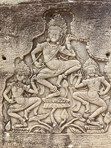 A carving on the surface of an ancient temple of Angkor Wat, Cambodia
