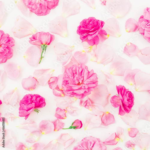 Floral pattern with pink roses and petals on white background. Flat lay, top view