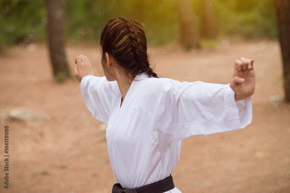 Woman In White Training Karate at Park Woman In White Training Karate at Park