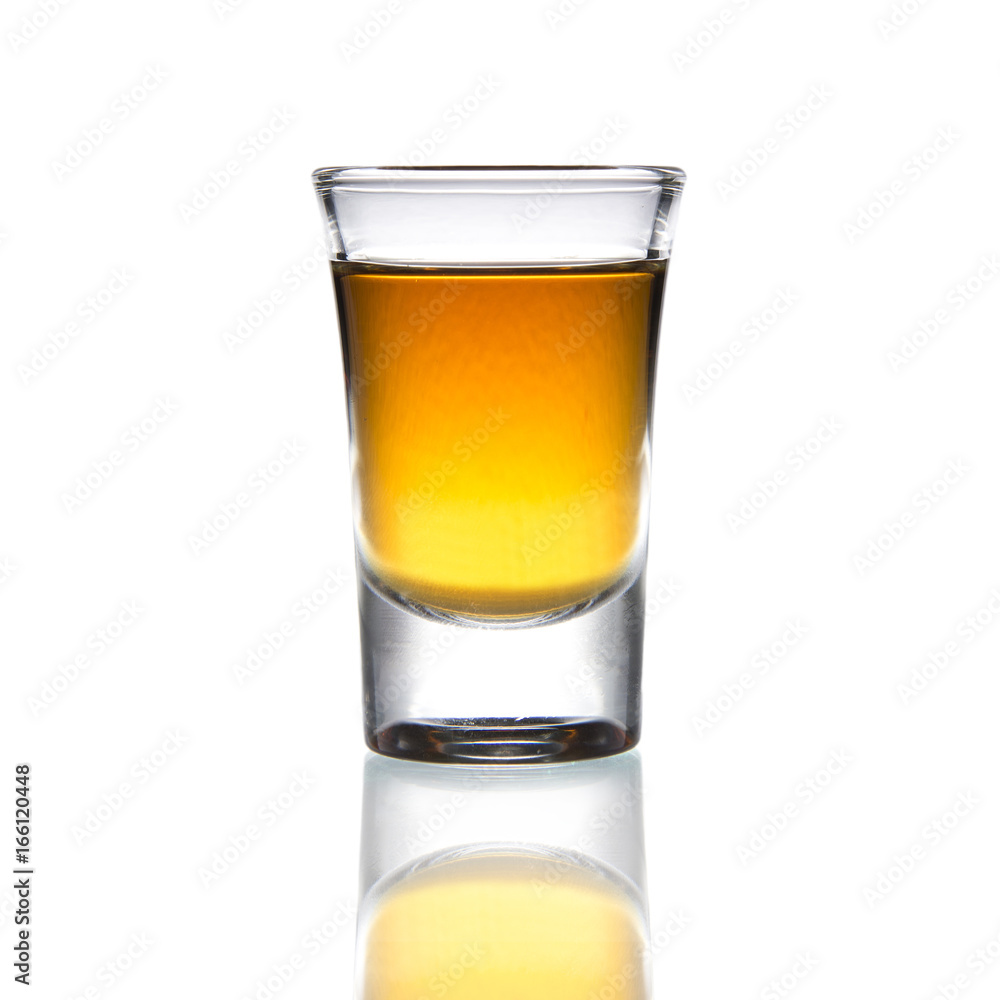Cocktail Glass with brandy or whiskey - Small Shot. Isolated on white background Cocktail Glass with brandy or whiskey - Small Shot. Isolated on white background