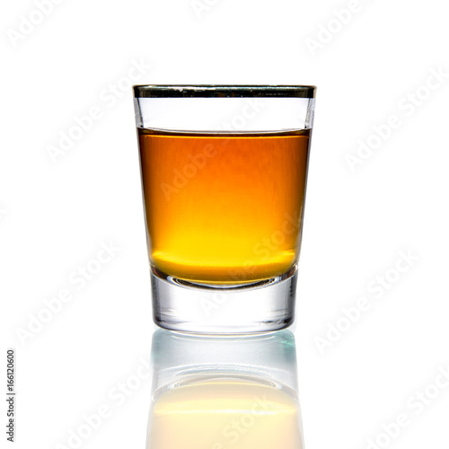 Cocktail Glass with brandy or whiskey - Small Shot. Isolated on white background photo