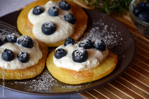 Fresh homemade pancakes with blueberries and cottage cheese. © martinedee