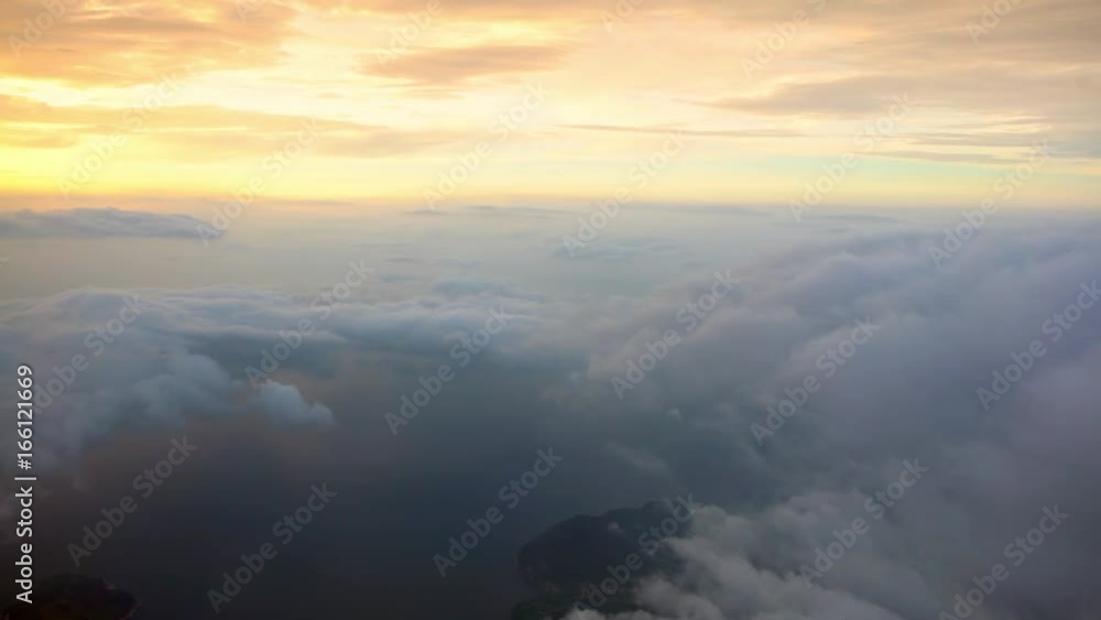 4K Traveling by air. Wonderful view of Busan, the sky and clouds with the sun from above, as seen through an airplane window with sunset-Dan 4K Traveling by air. Wonderful view of Busan, the sky and clouds with the sun from above, as seen through an airplane window with sunset-Dan
