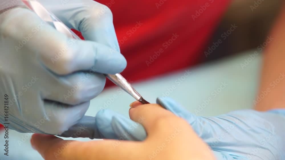 Manicure salon procedures The manicure master does the manicure to the