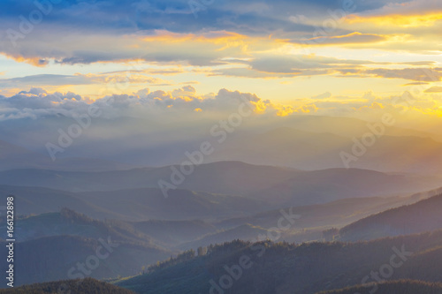 evening  mountain valley in a blue mist © Yuriy Kulik