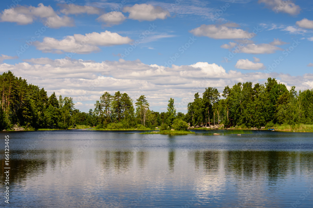 Obraz premium Beautiful landscape with lake and clouds. Vuoksa lake - a picturesque lake in Leningradskaya oblast, Russia