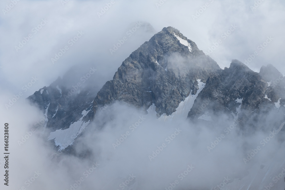 high mount peak in a dense clouds