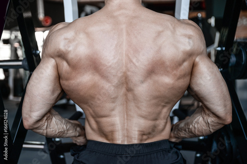 Strong bodybuilder man at the gym