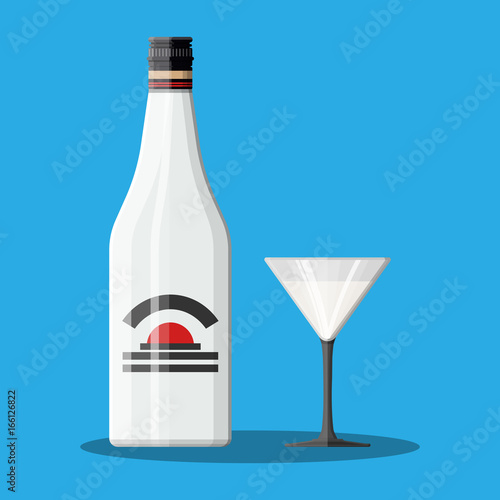 Bottle of rum with coconut and glass.