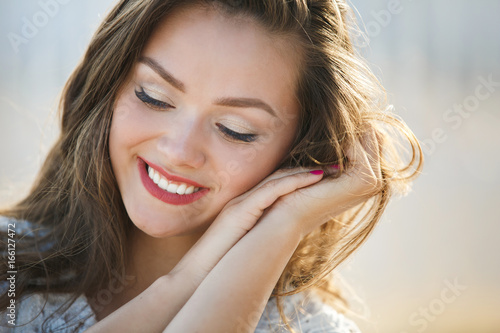 Portrait Of Young Smiling Beautiful Woman. Close-up portrait of a fresh and beautiful young fashion model
