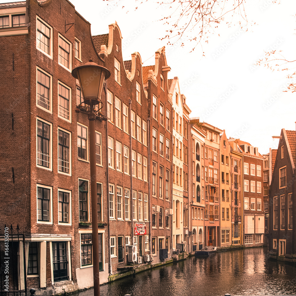 Amsterdam streets. View of narrow residential houses in historical city centre of Amsterdam, Netherlands.