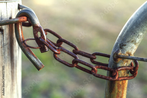 A rusty farm gate lock