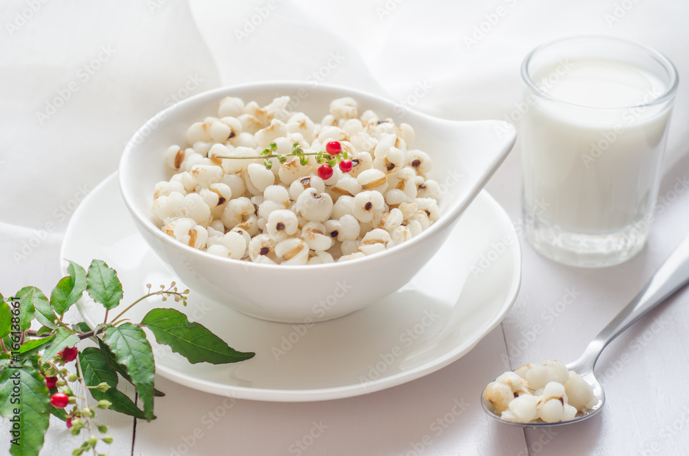 Healthy breakfast with boiled job's tears porridge in white bowl on wooden table. Healthy breakfast with boiled job's tears porridge in white bowl on wooden table.