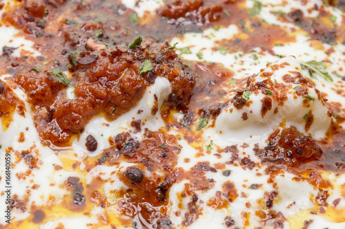 Turkish Ravioli with yogurt and tomato sauce . Plates of traditional Turkish food.