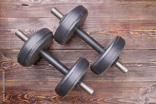 Bodybuilding workout dumbbells, top view. Metal equipment for muscle training.