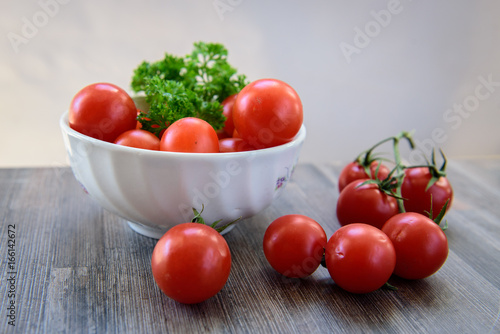 Vintage cherry tomatoes on a wooden table