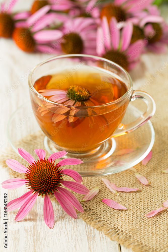 Cup of echinacea tea on white wooden table Cup of echinacea tea on white wooden table
