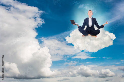 Businesswoman working in the sky and meditating