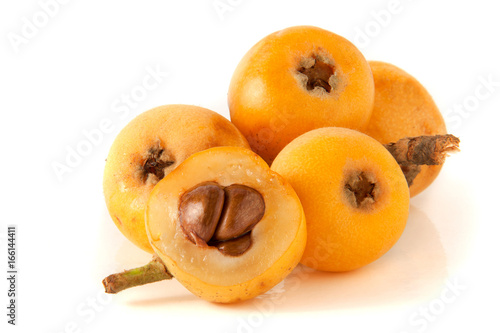 Ripe loquat or Eriobotrya japonica with leaf isolated on white background