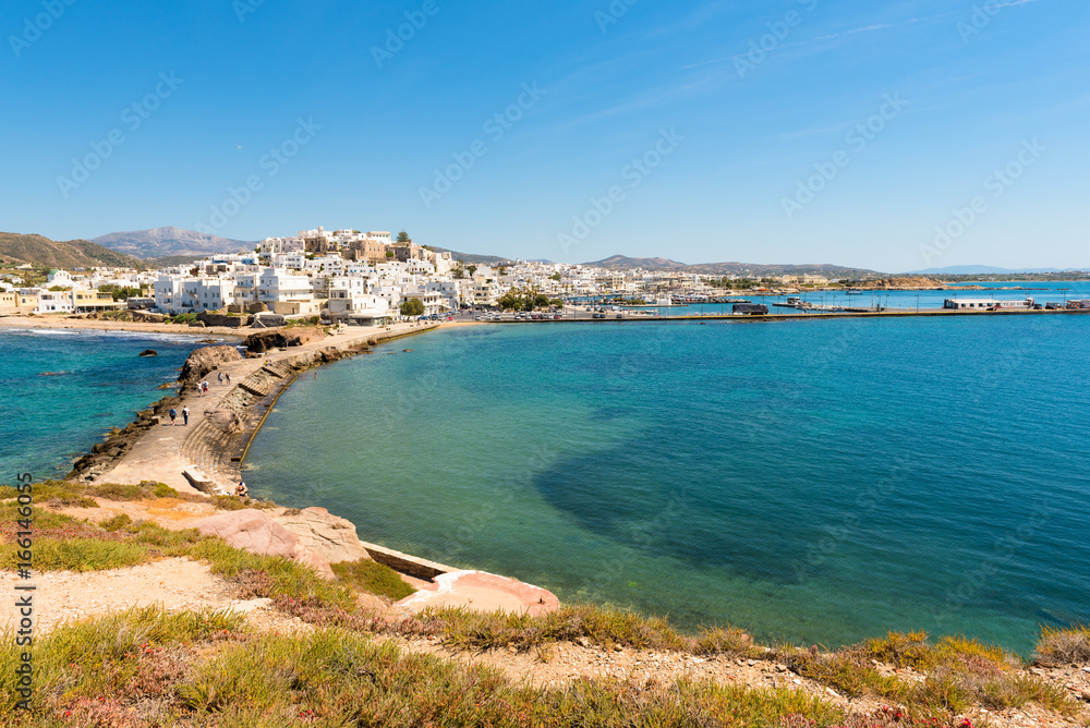 View of Chora town across the causeway from the Portara. Naxos island, Greece.