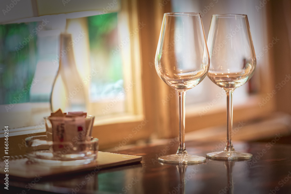 Wine glass in a restaurant closeup, warm and elegant Wine glass in a restaurant closeup, warm and elegant
