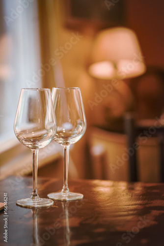 Wine glass in a restaurant closeup, warm and elegant