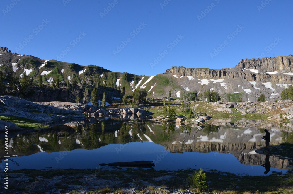 Hiker on Lake in Grand Teton National Park