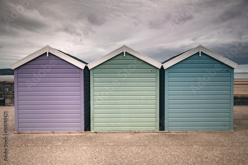 Beach Huts Purple Green and Blue Grey Sky Weston Super Mare