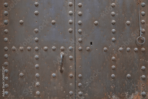 Old metal door with decorative elements