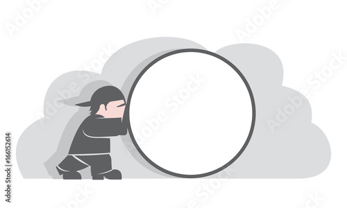 Man rolling a round object