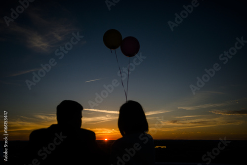 Couple watch the sunset