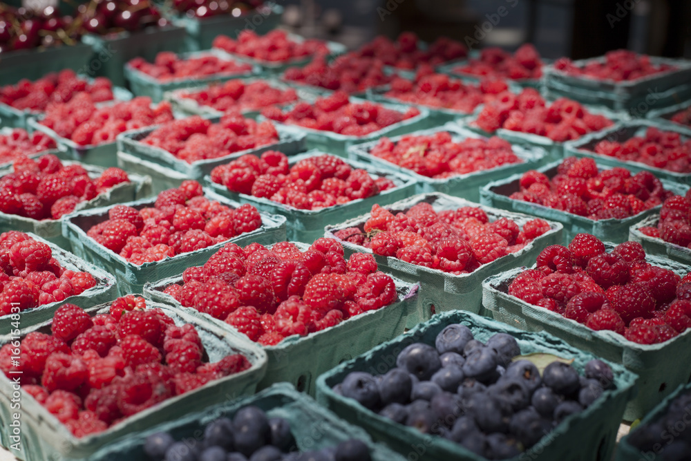 Raspberries in cartons for sale at a farmers market