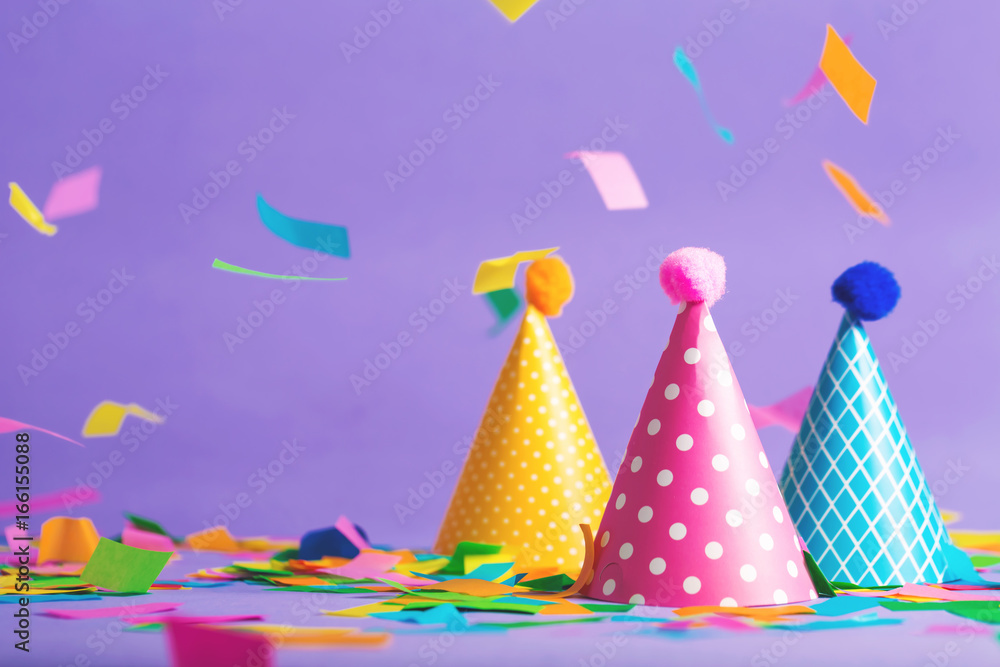 Party hat celebration theme with confetti on a bright background - obrazy, fototapety, plakaty 